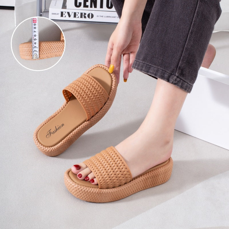 A woman wearing women's platform espadrille sandals with a lightweight Roman-inspired design.