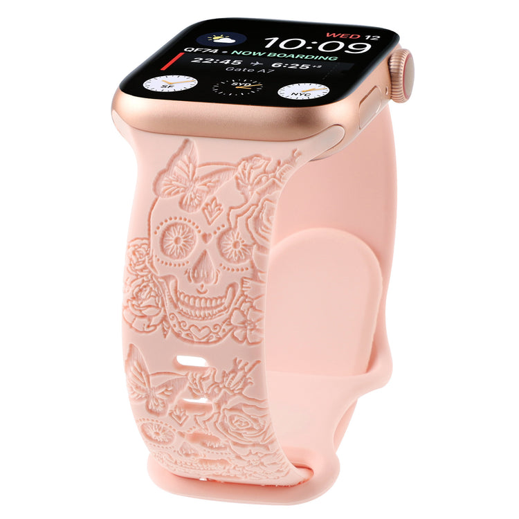 Relief 8-Character Buckle Skull Carving Silicone Watch Strap with a decorative pink band featuring skull and floral designs on a white background