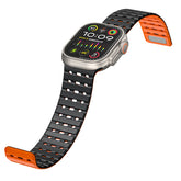 Breathable Magnetic-Attachment Perforated Watch Strap with black and orange band on a white background