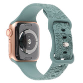 RRelief 8-Character Buckle Skull Carving Silicone Watch Strapwith a decorative green band on a white background
