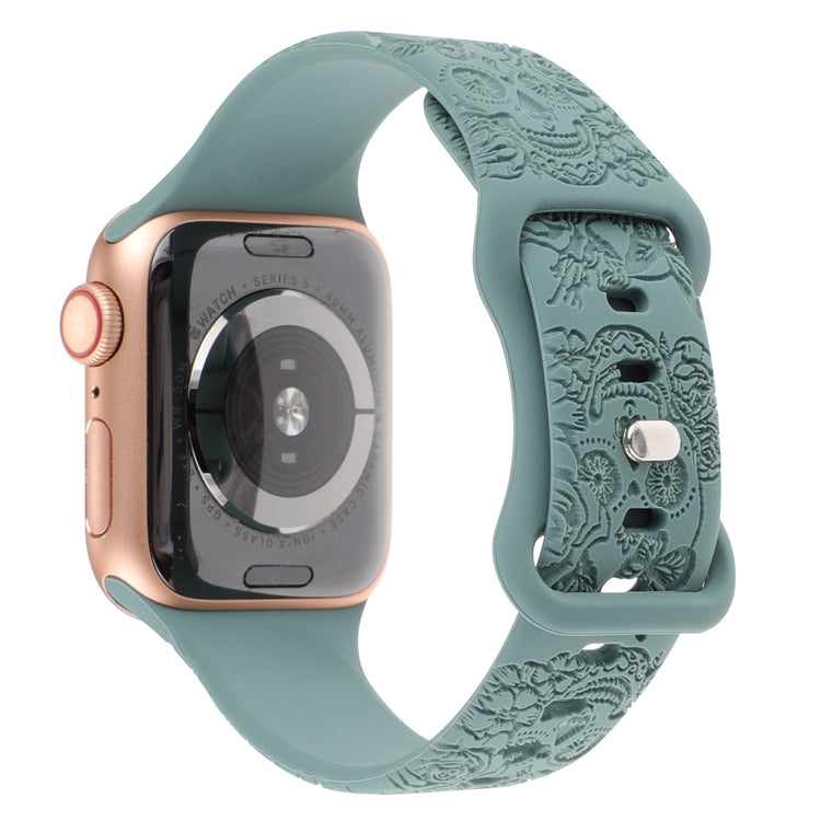 RRelief 8-Character Buckle Skull Carving Silicone Watch Strapwith a decorative green band on a white background