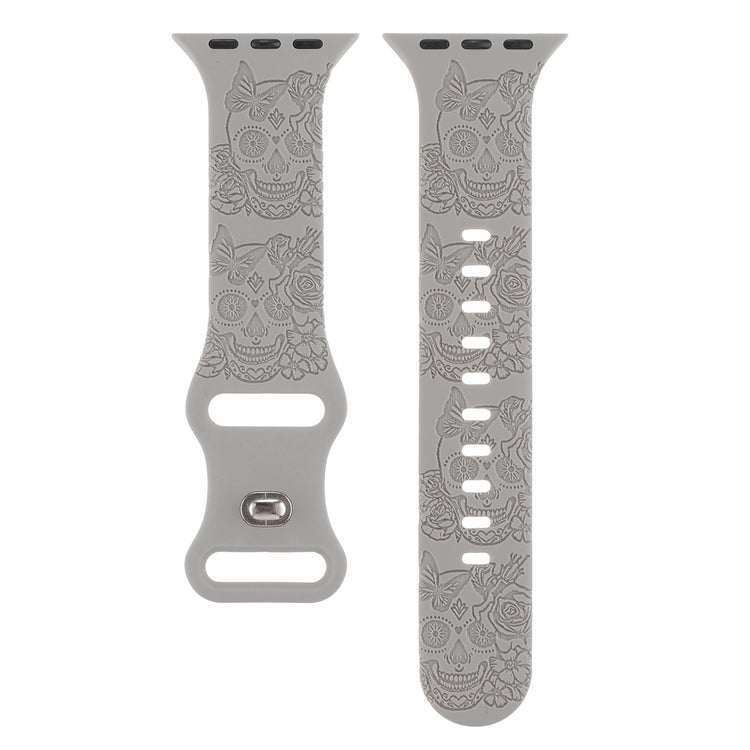Relief 8-Character Buckle Skull Carving Silicone Watch Strapand skull patterned watch band on a white background