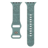 Relief 8-Character Buckle Skull Carving Silicone Watch Strapwith skull and floral design on a white background
